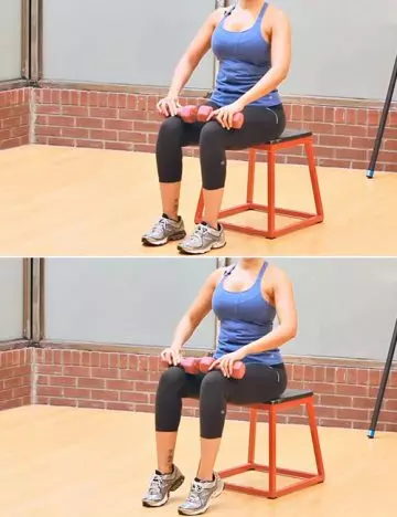 Seated calf raises with weights to reduce calf fat