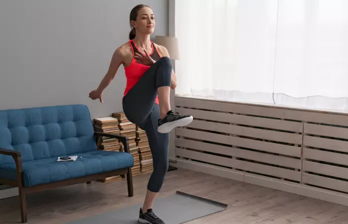 Woman doing high knees exercise