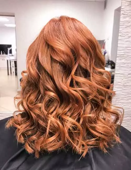 Curly ginger brunette hair
