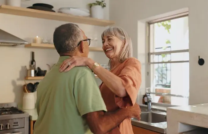 A happy old couple dancing