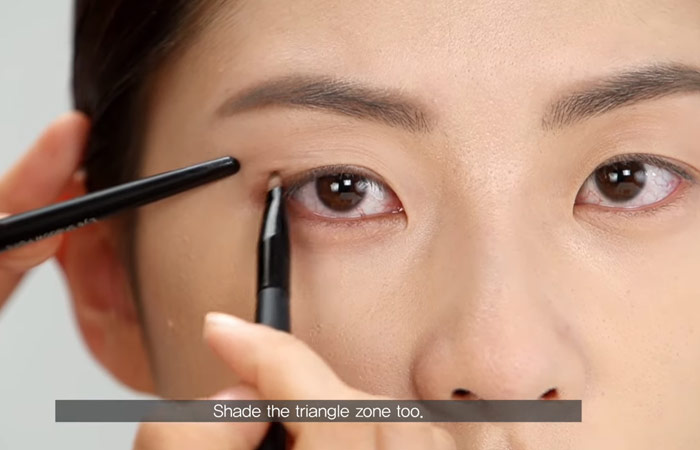 Step 3 of hooded eye makeup is to create a base shape
