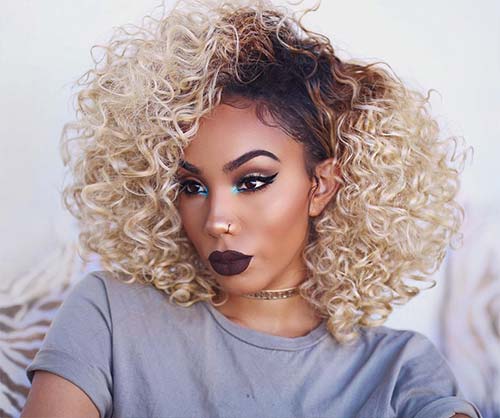 Dark roots and bleached blonde hair color for black women