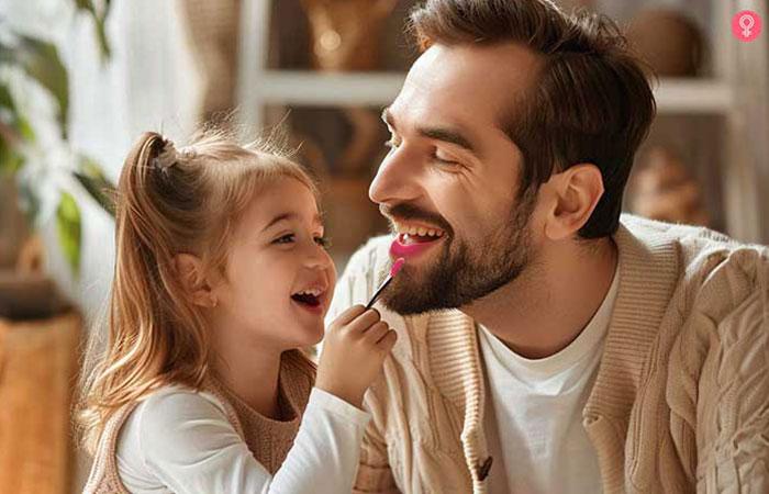 Girl applying lipstick to amused adult man