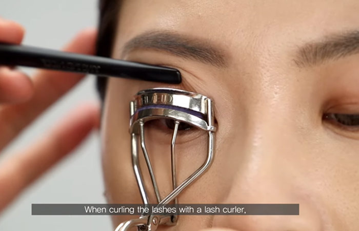 Step 6 of hooded eye makeup is to use an eyelash curler