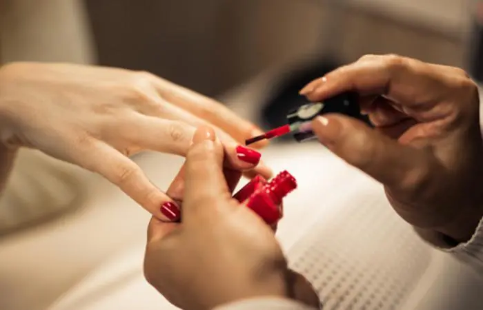 A woman getting her nails done