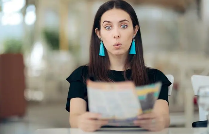 A woman reading her horoscope