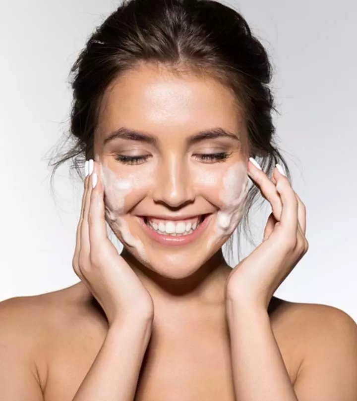 Woman Cleaning Her Face At Home