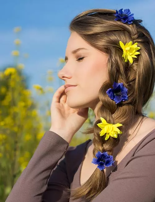 Accessorized side braid hairstyle for a glamorous look