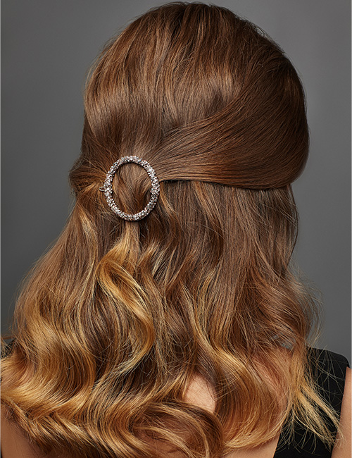 Clipped half up-half down hairstyle