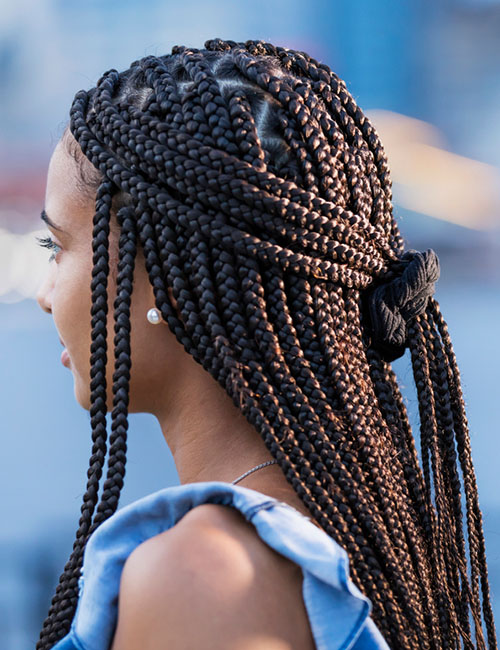 Half ponytail box braids protective hairstyle