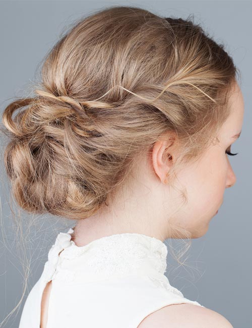 Low bun side braid hairstyle for a fancy event