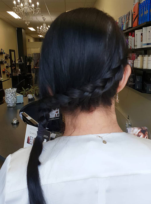 Slanted side braid hairstyle for gym