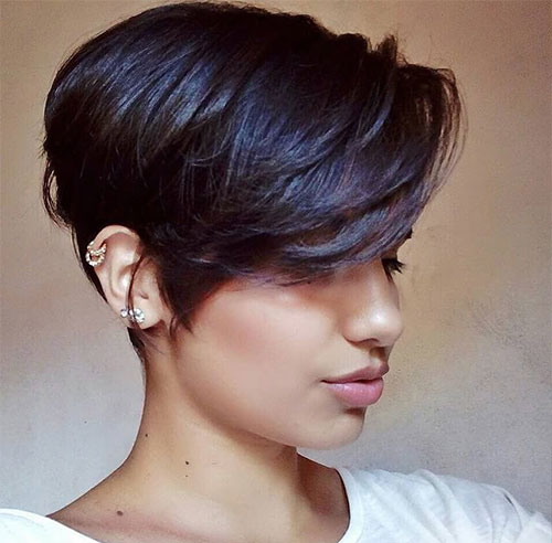 Short pixie cut with thick side-swept bangs