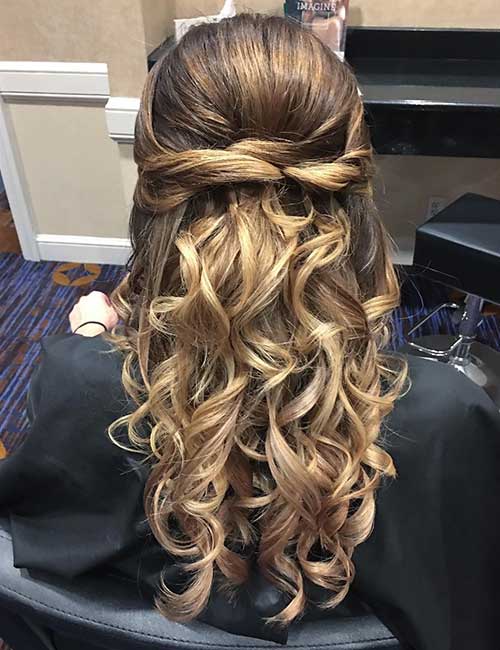 Twisted and curled half up-half down hairstyle