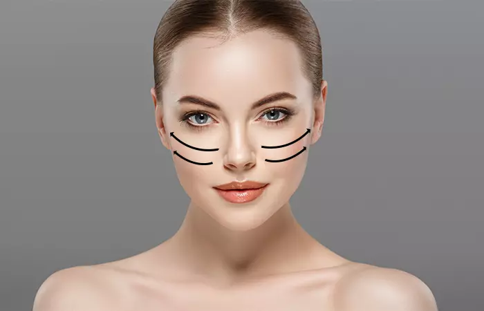 Apply pink blush powder to cheeks for a flushed look