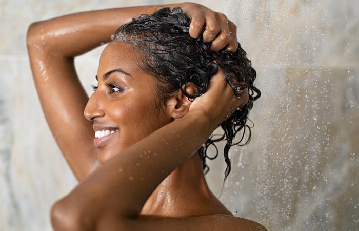 Prepare hair by applying shampoo for finger coils