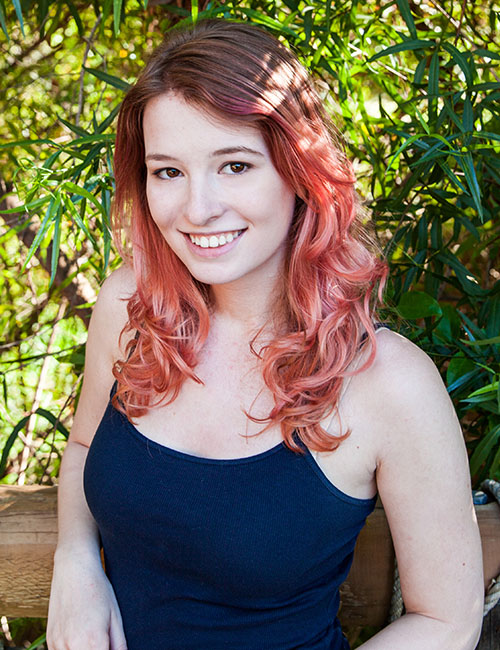 Woman sporting a rose brown and pink ombre hair color