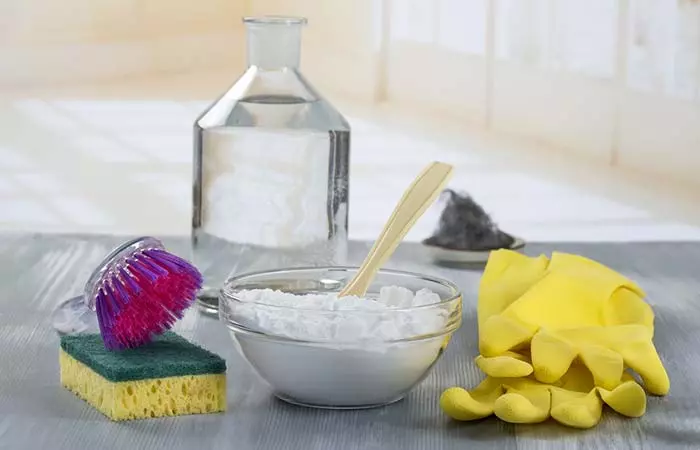 Take some coarse salt and rub it inside the jar using the sponge