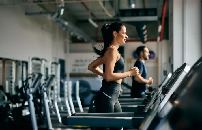 A woman and man in a gym