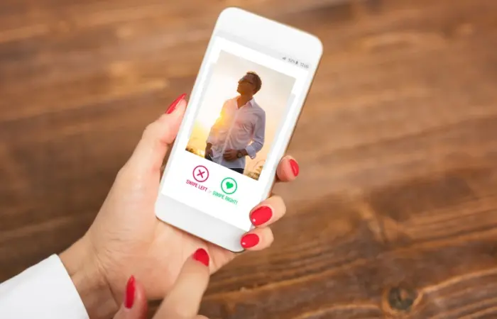 A woman using Tinder