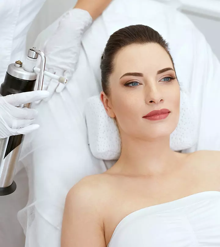 Woman Doing Cryotherapy Facial Treatment