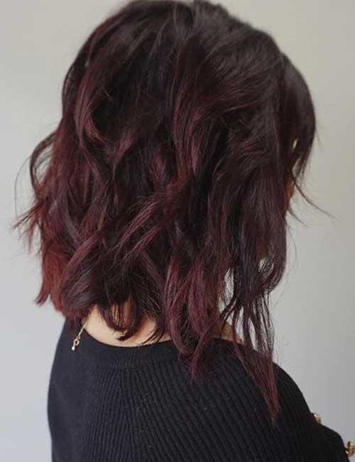 Dark plum textured lob medium length haircut