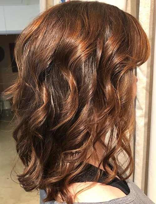 Deep auburn curls medium length haircut