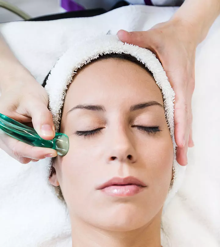 Woman Doing Facial Acupuncture