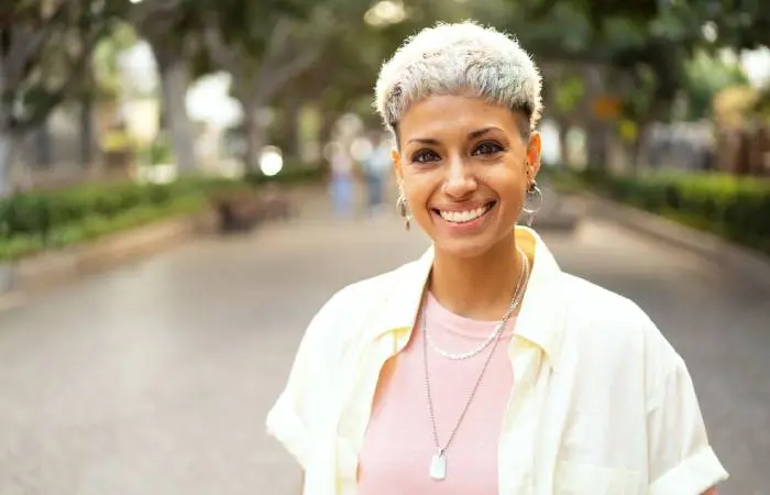 A woman in a short gray hairstyle