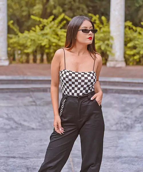 Black and white checkered bodysuit and baggy trousers