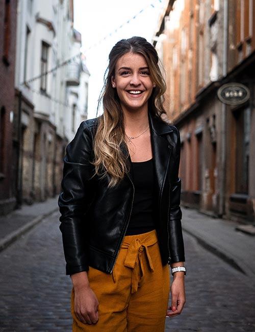 lady-in-black-leather-jacket-and-brown-pants