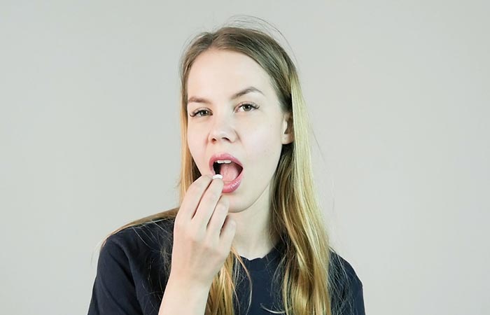 Woman having mastic gum