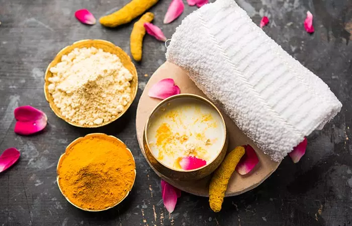 Bowls of raw rice, lentils, turmeric, and more to offer glowing skin