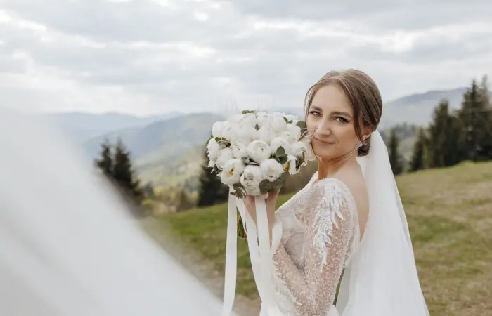 A bride posing with flowers