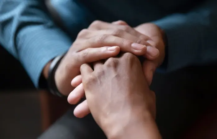 A couple holding hands