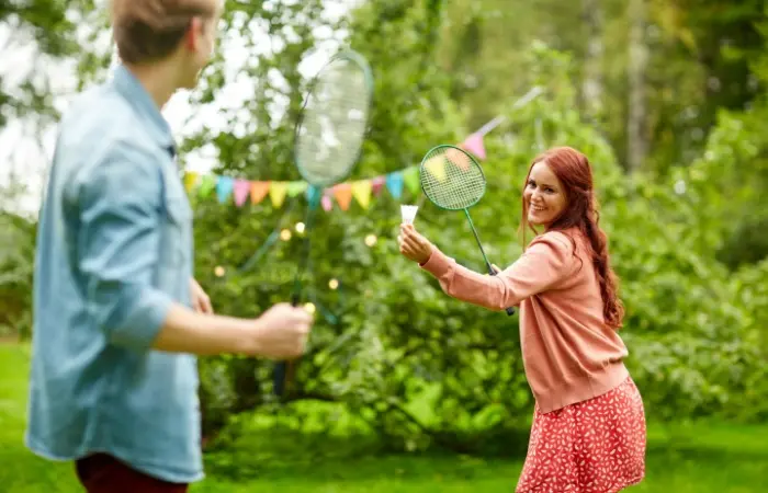 A couple playing badminton