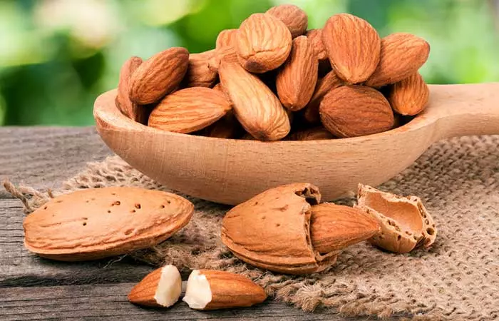 Almonds and milk on the table for muscle weakness