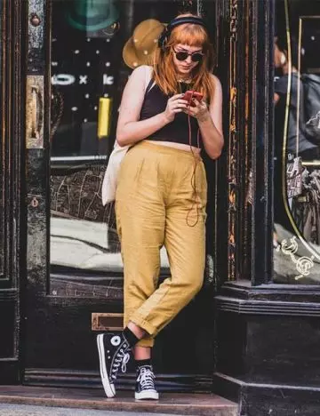 Black crop top and yellow trousers with converse shoes