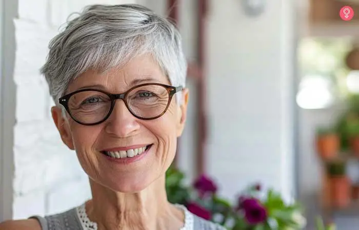 Classic pixie hairstyle for older women with glasses