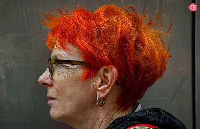 Dimensional pixie hairstyle for older women with glasses