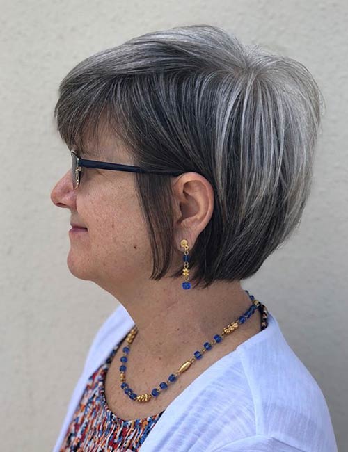 Long sideburns hairstyle for older women with glasses
