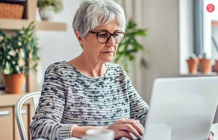 Messy pixie hairstyle for older women with glasses