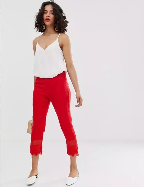 Red lace hem trousers with white noodle strapped top