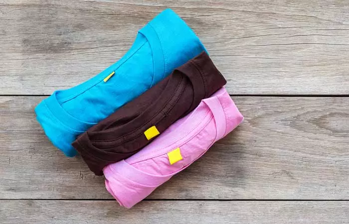 Rolling The T-shirts And Stacking Them