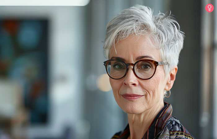 Silver fox pixie hairstyle for older women with glasses