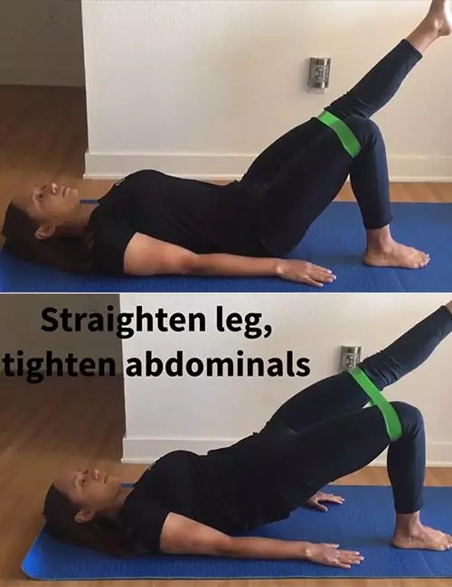 Single leg bridge with resistance band exercise to reduce lower back pain