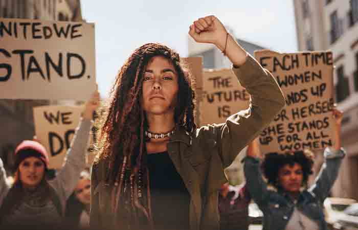 Woman leading a public protest for women empowerment