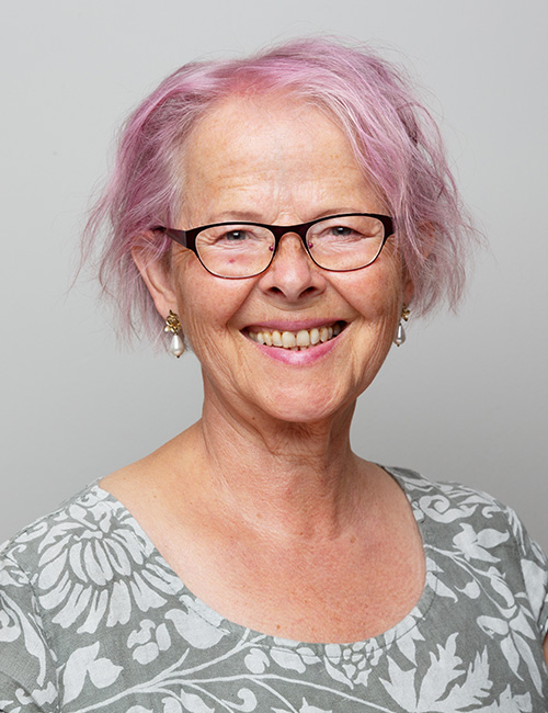 Soft colors hairstyle for older women with glasses