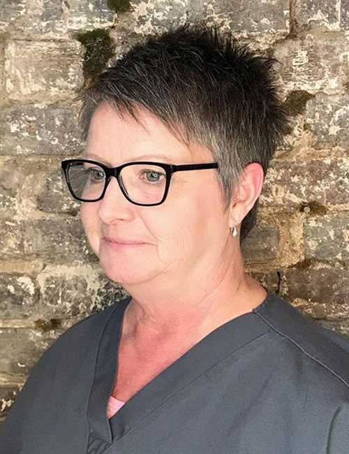 Spunky pixie hairstyle for older women with glasses