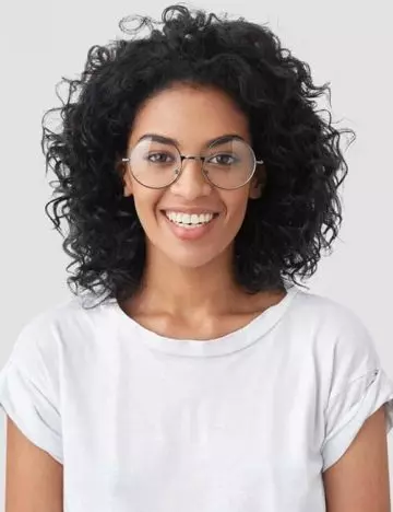 Unraveled curls hairstyle for women with glasses